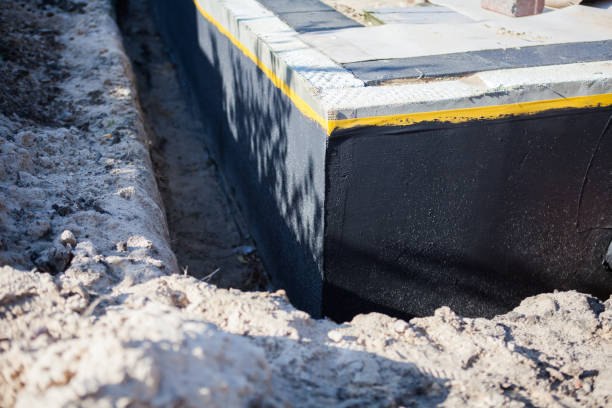 Professional Waterproofing technician working in Packwaukee, WI